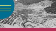 aerial view of an open-pit mine with terraced levels carved into the earth